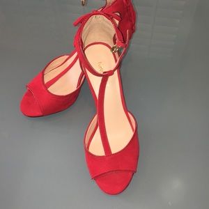Red Nine West heels with lace back detail